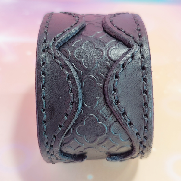 Handmade leather bracelet with cut-out embossed leather.