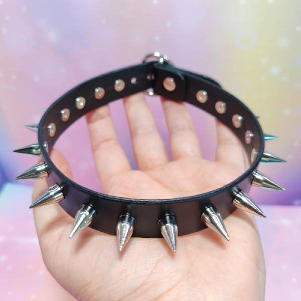 Handmade leather choker with metal studs.